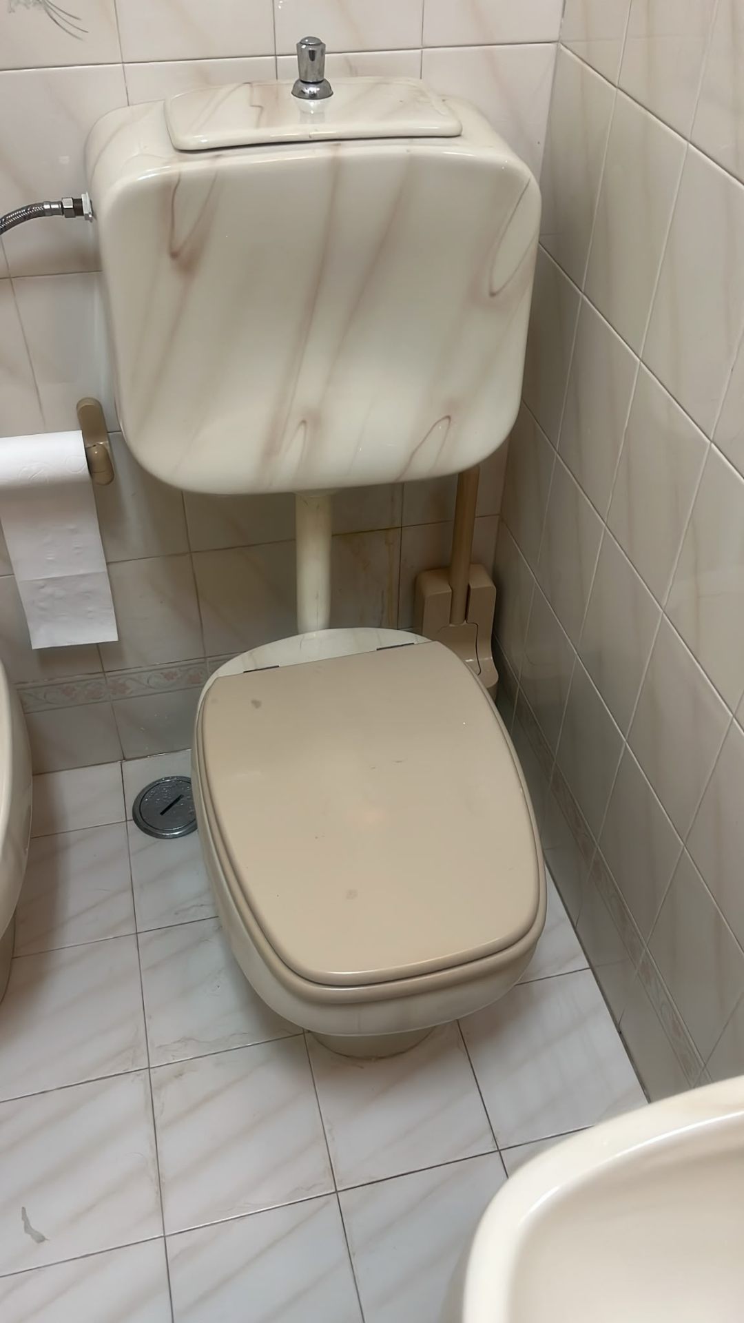Old toilet with cistern before replacement