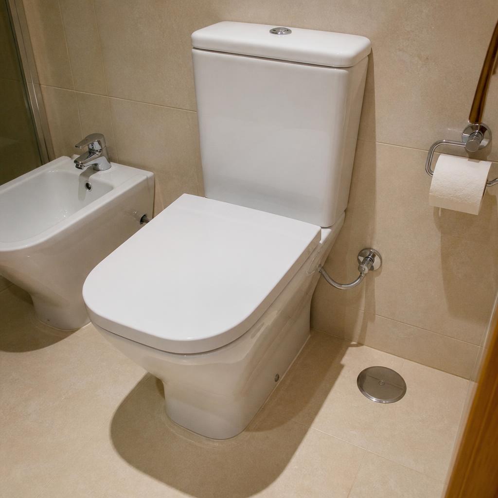 Modern white toilet installed in a clean Lisbon bathroom